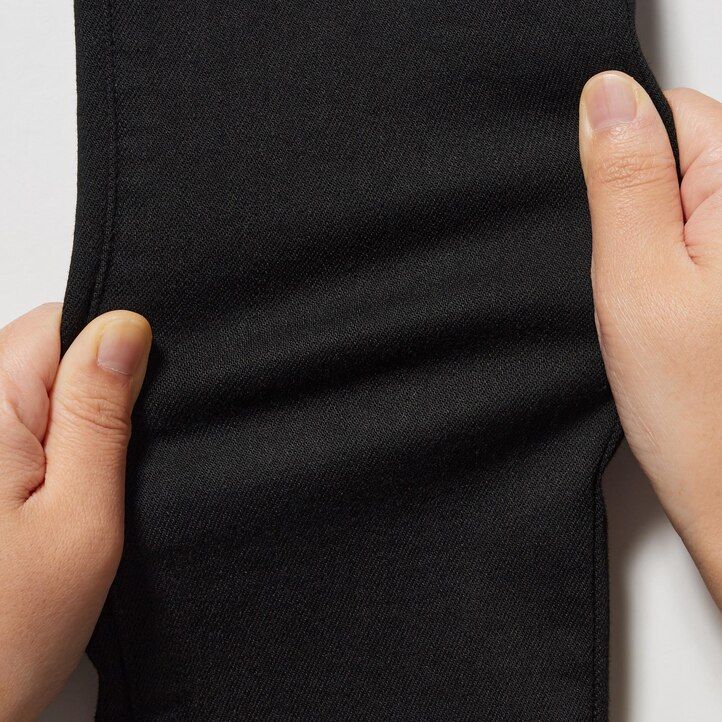 modre ženske kavbojke uniqlo ultra stretch z visokim pasom in oprijetim krojem