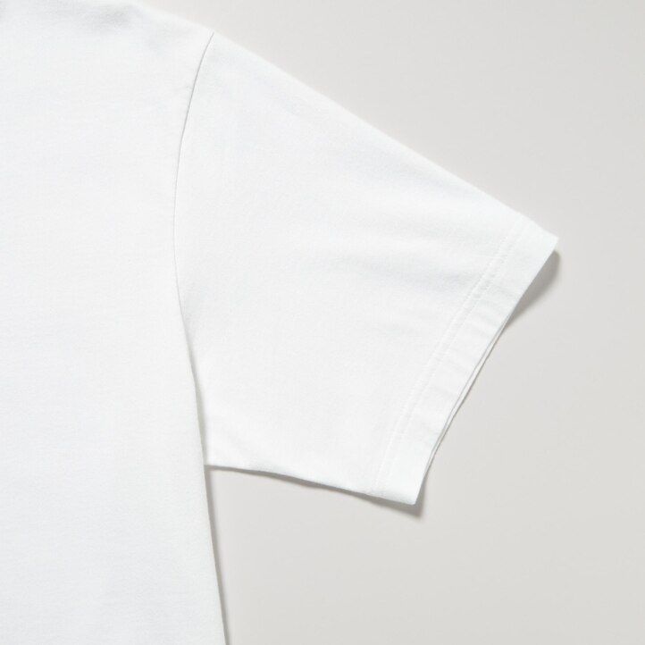 bele ženske majice uniqlo peace for all z grafičnim napisom tadao ando