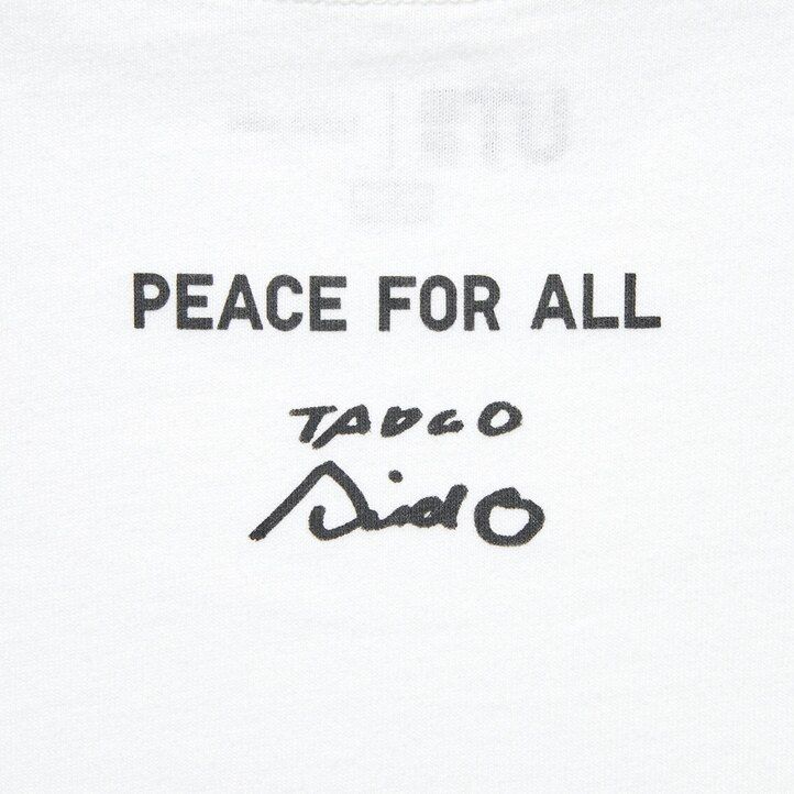 bele ženske majice uniqlo peace for all z grafičnim napisom tadao ando